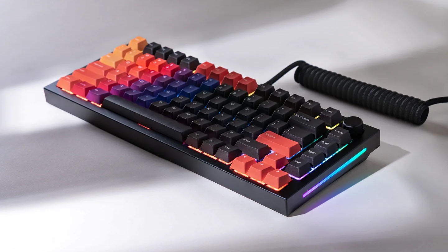 A photo of a fully assembled GMMK Pro keyboard rests on a surface.