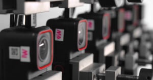A line of Insta360 Ace Pro action cameras in a testing lab.